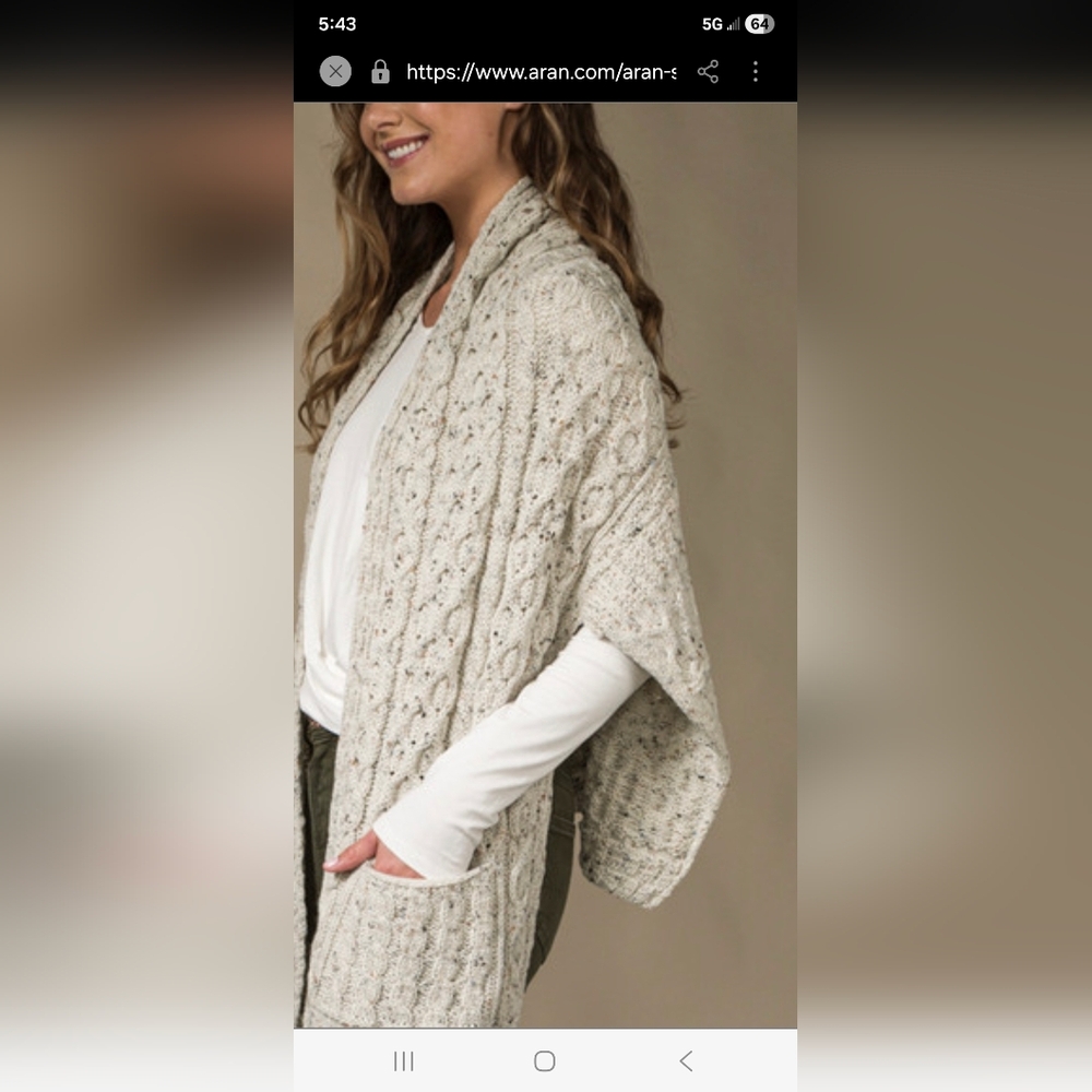 Aran Crafts knitted shawl or wrap with pockets